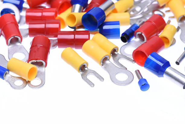 Assorted electrical wire connectors and terminals on a white background.