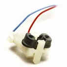 Plastic electrical connector with two wires attached.