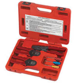 A set of crimping tools with interchangeable jaws in a red plastic case.
