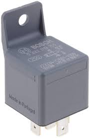 A gray relay sitting on top of a white table.