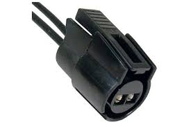 Black electrical plug with two prongs on a white background.