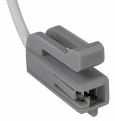 Close-up of a gray plastic electrical connector with a single attached wire.