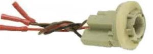 Electrical connector with exposed and twisted red wires.