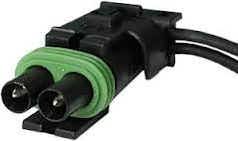 A green and black cable is connected to the connector.