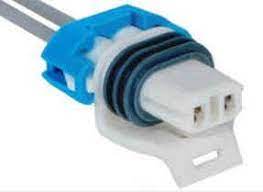 A blue and white connector is connected to the wires.
