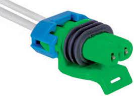 A green and blue connector is connected to the wire.