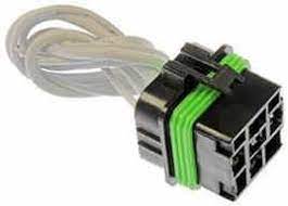 A green and black connector is connected to wires.