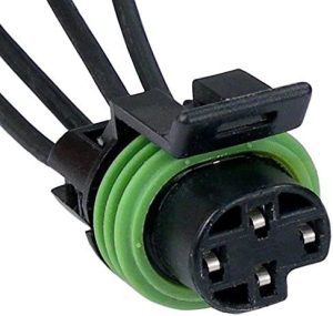 A green and black wire is connected to the connector.