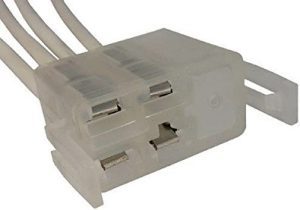 A close up of the wires on a white box