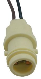 A close up of the plastic part on a white object.