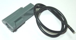 A black cord is connected to the gray connector.