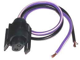 A black and purple wire is connected to an electrical connector.