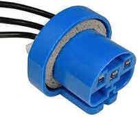 A blue plastic plug with wires attached to it.