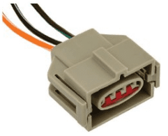A gray connector with wires attached to it.