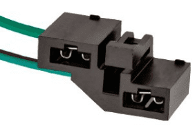 A black connector with two wires attached to it.