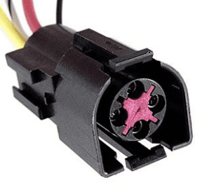 A black and red connector is connected to wires.