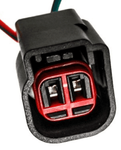 A black and red connector is connected to wires.