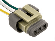 A gray connector with wires attached to it.