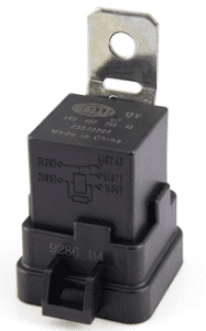 Automotive relay with specifications printed on the casing.