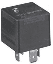 A black relay is sitting on top of the ground.