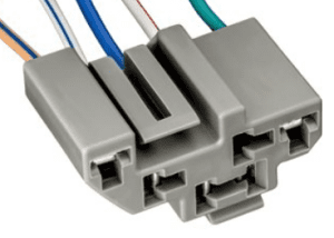 A close up of the wires on a gray connector