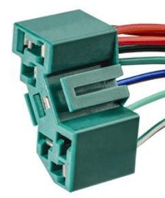 A green electrical connector with wires attached.