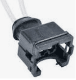 A black connector with a white wire.