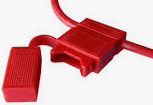 A red cable with a piece of plastic